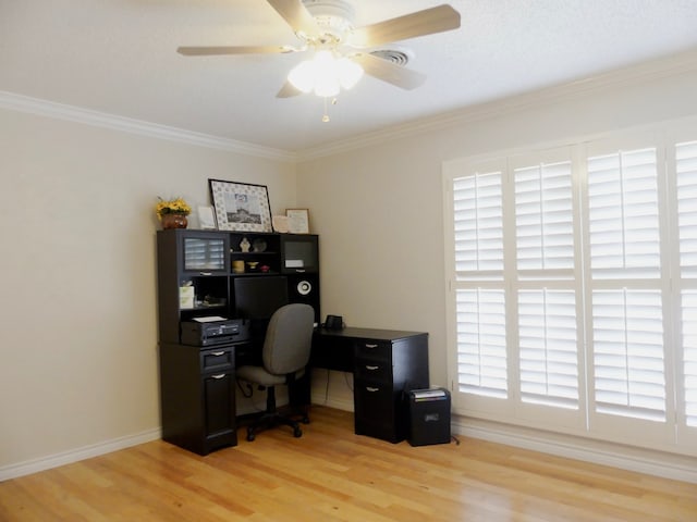 office area with crown molding, light wood-type flooring, a ceiling fan, and baseboards