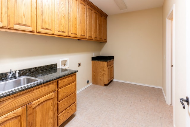 washroom with sink, cabinets, washer hookup, light tile patterned flooring, and hookup for an electric dryer