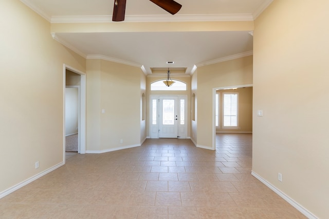 entryway with crown molding and ceiling fan