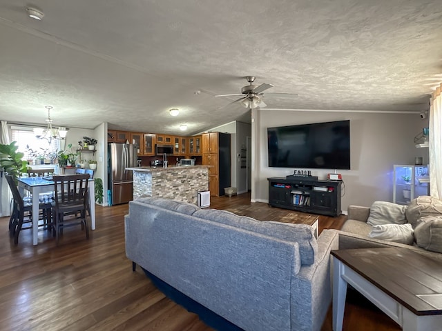 living room with lofted ceiling, ceiling fan with notable chandelier, dark wood-style flooring, and a textured ceiling