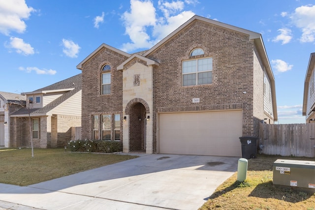 front of property with a front yard and a garage