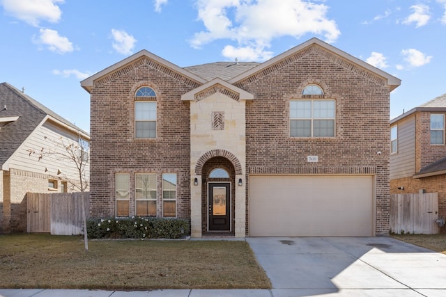 front of property with a front yard and a garage