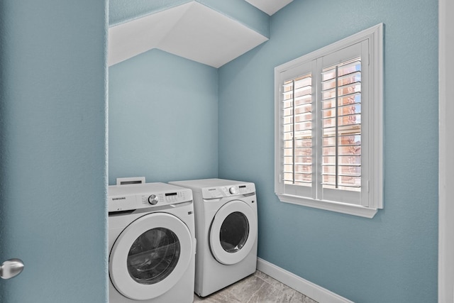 washroom with independent washer and dryer and light tile patterned floors