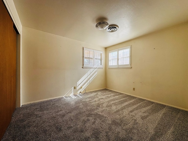 empty room featuring carpet floors