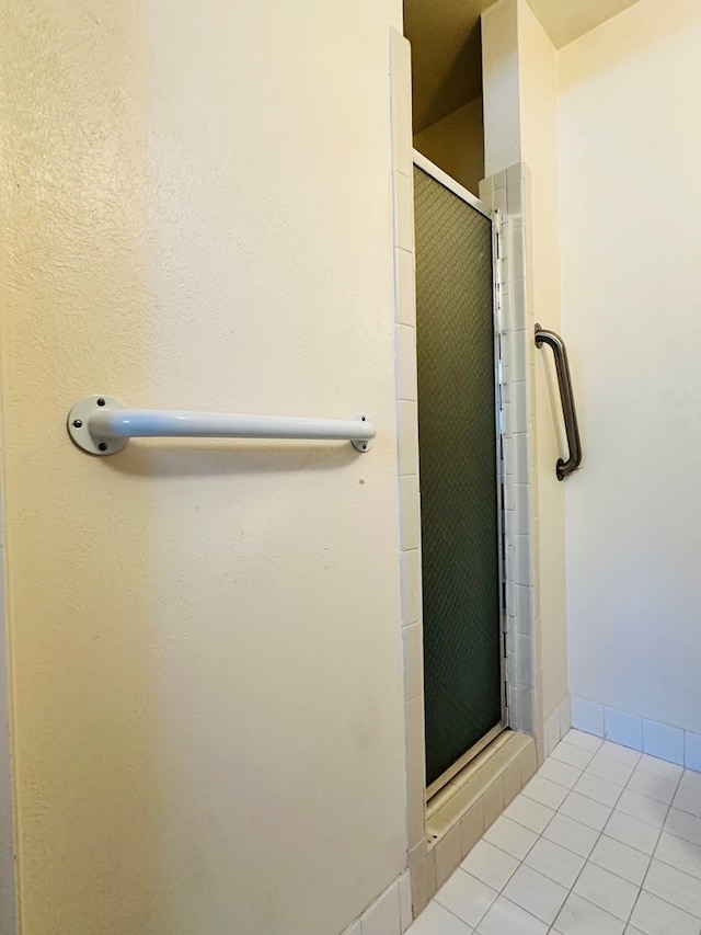 bathroom featuring tile patterned flooring and walk in shower