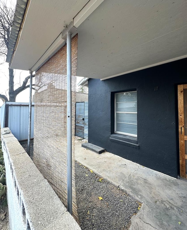 view of property exterior featuring fence