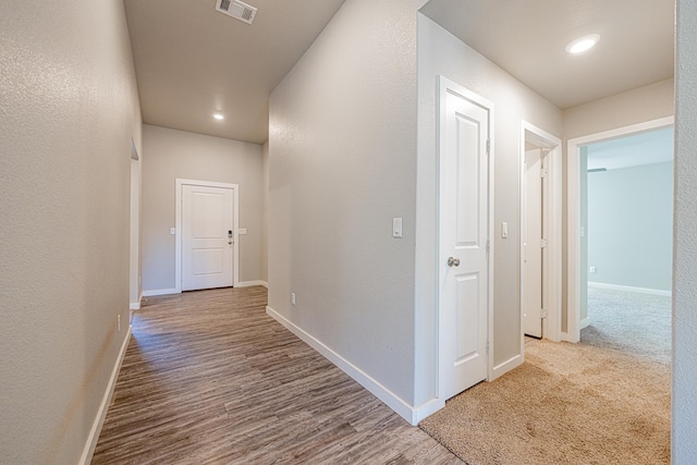 corridor featuring light hardwood / wood-style flooring