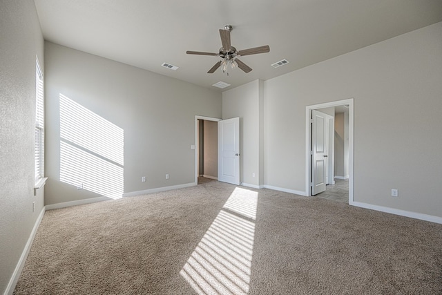 unfurnished bedroom featuring ceiling fan and light colored carpet