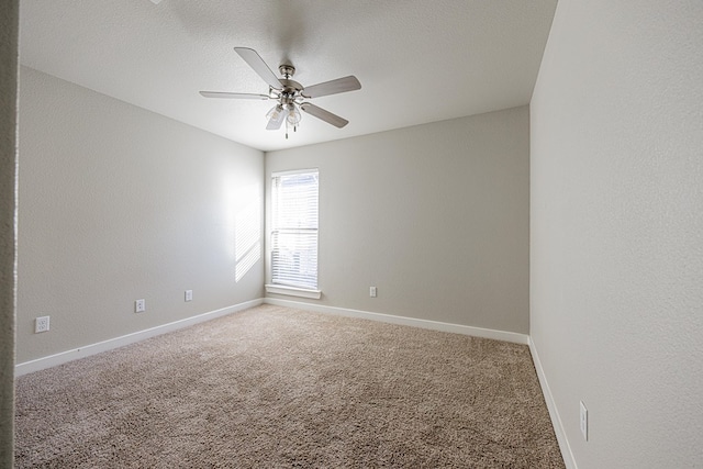 empty room featuring carpet floors, a textured ceiling, and ceiling fan