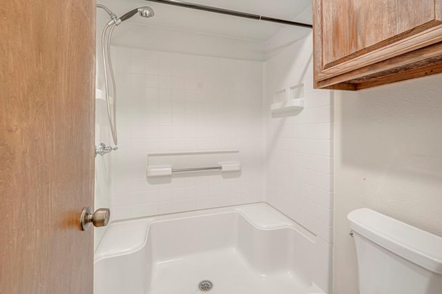 bathroom with toilet and walk in shower