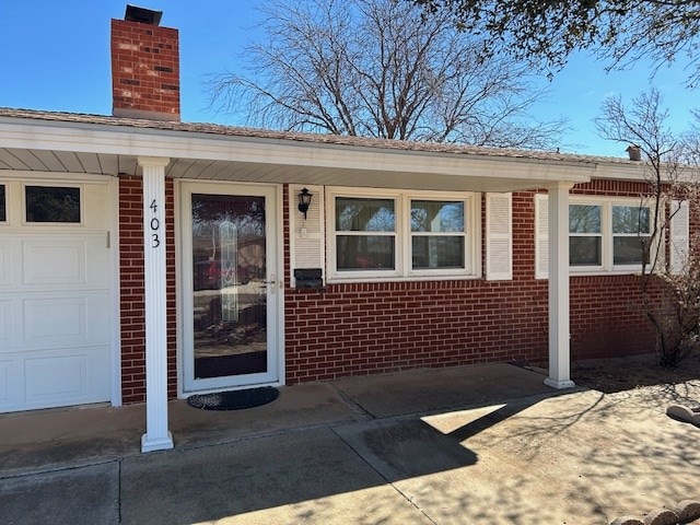 property entrance featuring a garage