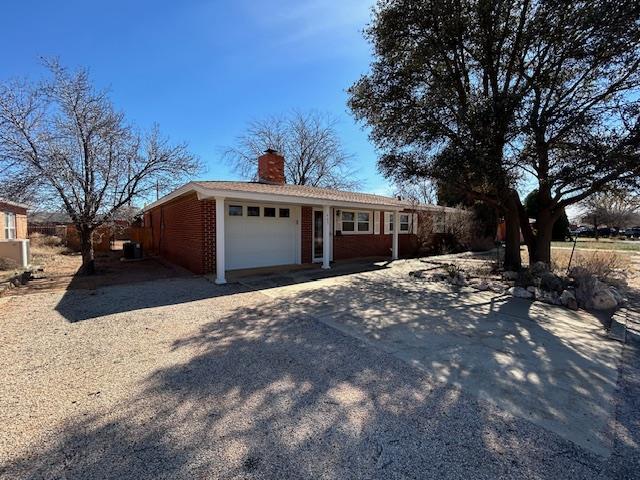 single story home featuring a garage