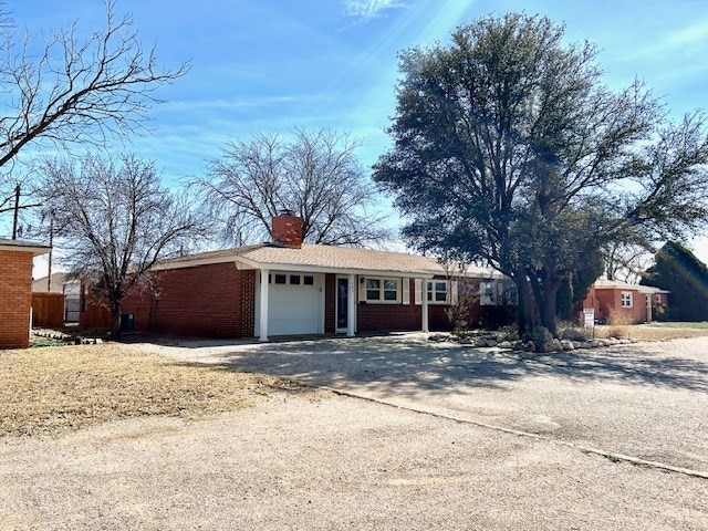 ranch-style home featuring a garage