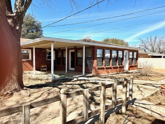 back of house featuring ceiling fan and a patio area