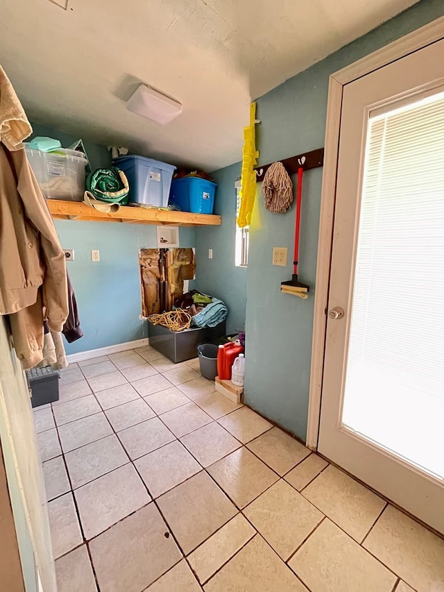 laundry room with tile patterned floors