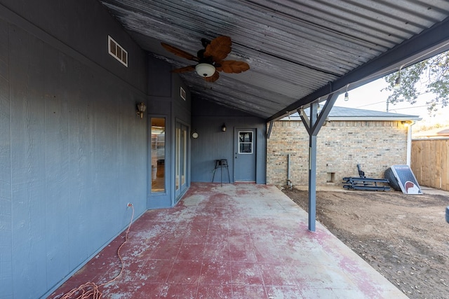 view of patio / terrace featuring visible vents, fence, and a ceiling fan