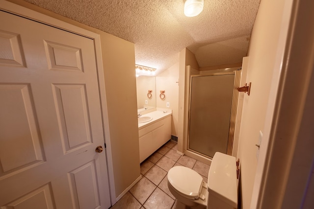 full bath with a stall shower, vanity, toilet, and a textured ceiling