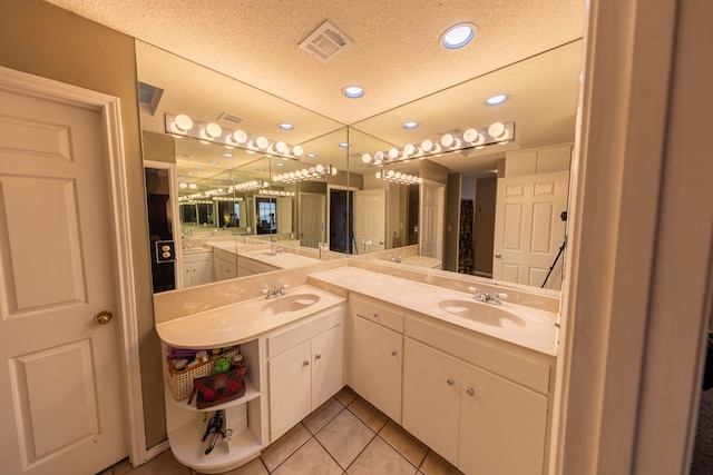 bathroom with recessed lighting, vanity, visible vents, and tile patterned floors