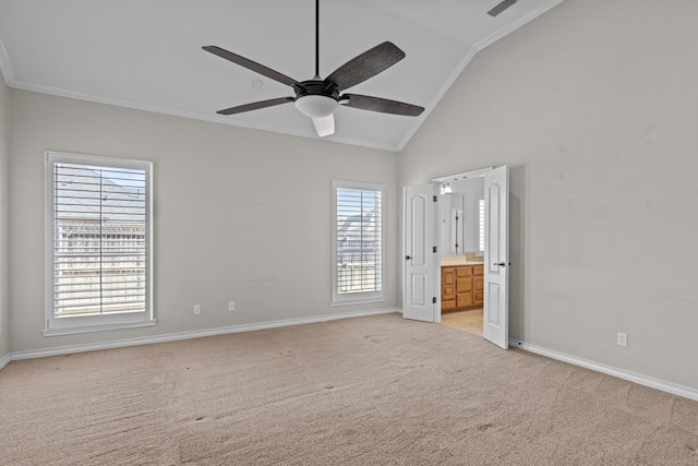 unfurnished bedroom with ceiling fan, light carpet, connected bathroom, and ornamental molding