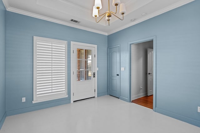 empty room with a wealth of natural light, an inviting chandelier, and ornamental molding