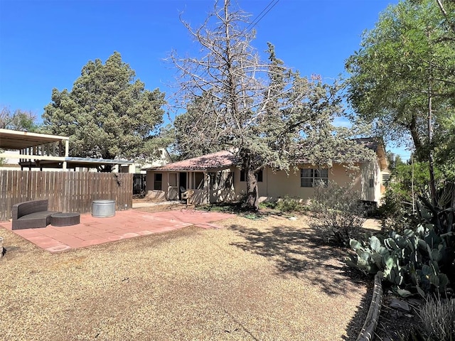 back of property featuring a patio area