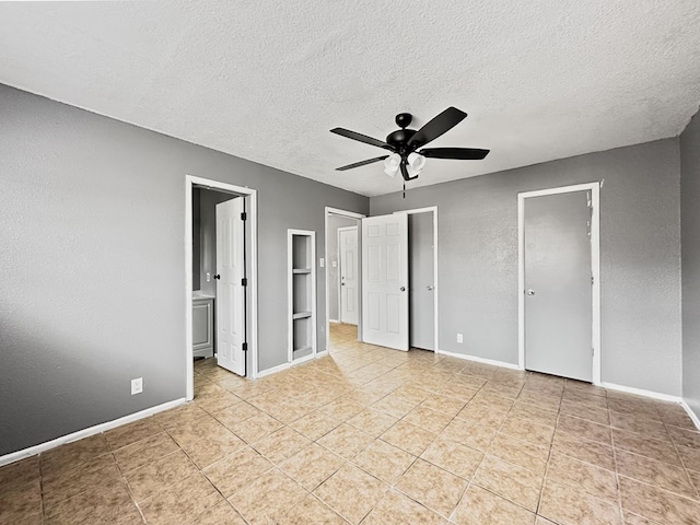 unfurnished bedroom featuring a textured ceiling, ceiling fan, light tile patterned floors, connected bathroom, and a closet