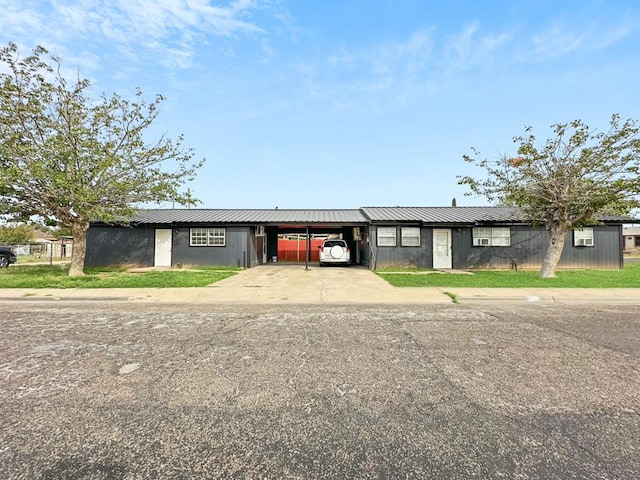 single story home featuring a carport