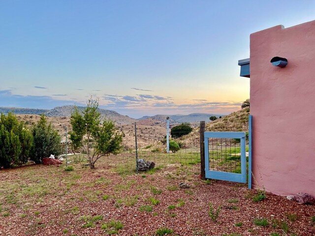 yard at dusk with a mountain view