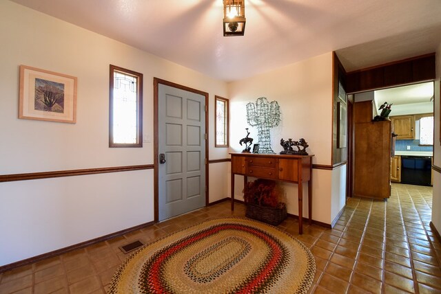 entrance foyer featuring tile patterned flooring