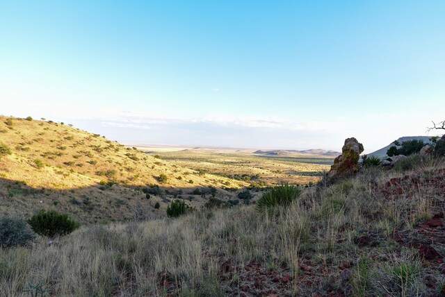 property view of mountains featuring a rural view