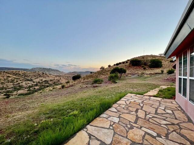 view of yard at dusk