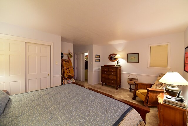 carpeted bedroom featuring a closet