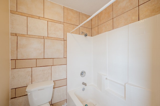 bathroom featuring  shower combination, tile walls, a textured ceiling, and toilet