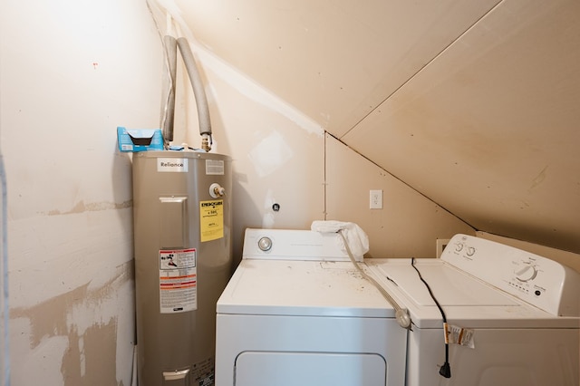 laundry area featuring electric water heater and washing machine and clothes dryer