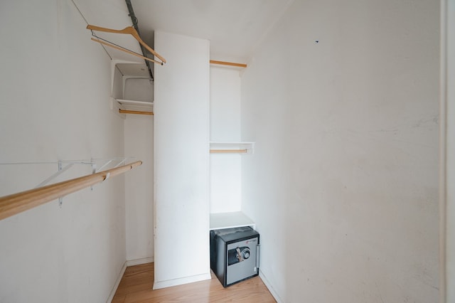 spacious closet featuring light hardwood / wood-style flooring