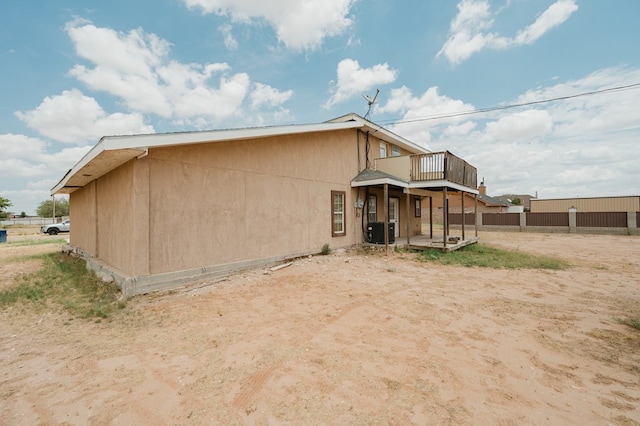 back of property with central AC unit