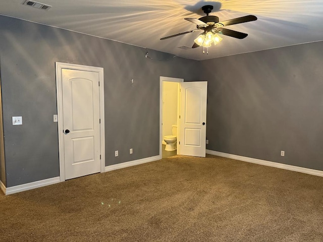 unfurnished bedroom with carpet, ceiling fan, and connected bathroom