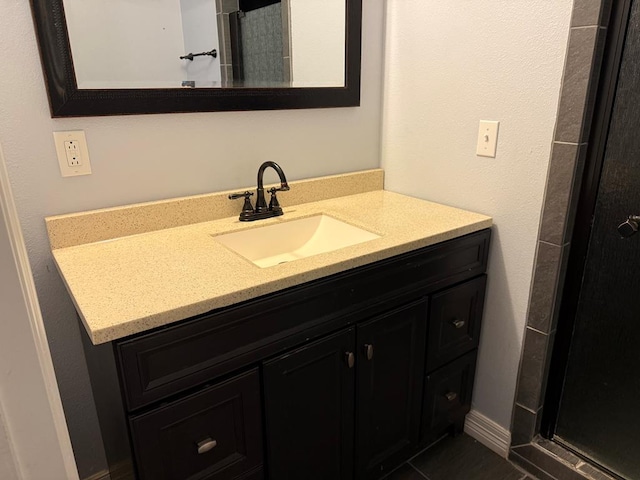 bathroom featuring tile patterned floors and vanity