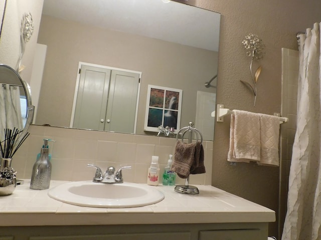 bathroom with vanity and backsplash