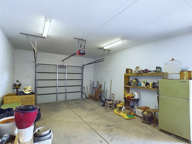 garage featuring refrigerator and a garage door opener