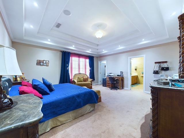 carpeted bedroom featuring crown molding, connected bathroom, and a raised ceiling