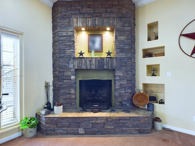 living room with a stone fireplace, crown molding, and carpet