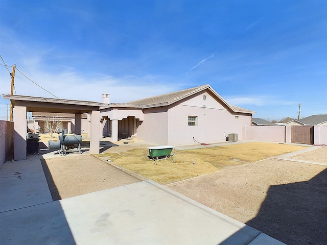 exterior space featuring a storage unit, a patio area, and central AC unit