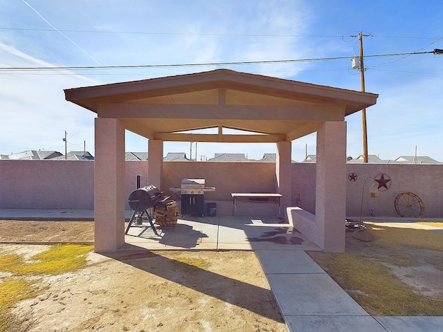 view of patio with grilling area and a gazebo