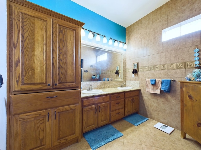 bathroom with tile walls, tile patterned flooring, and vanity