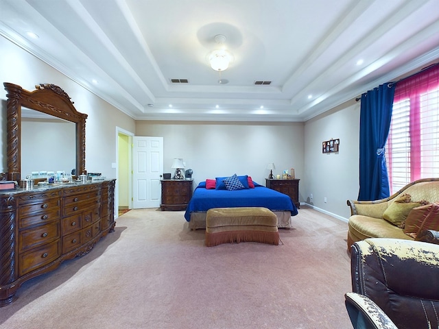 bedroom featuring a raised ceiling and light colored carpet