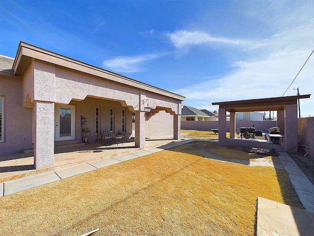 rear view of house featuring a patio area