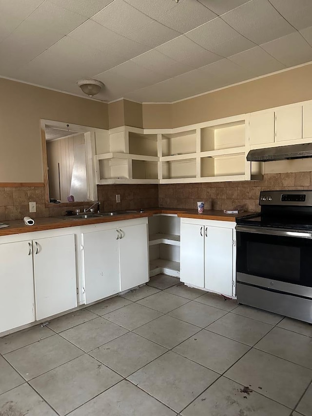 kitchen with white cabinetry, stainless steel electric stove, and sink