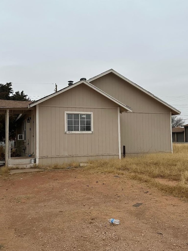 view of side of property with cooling unit