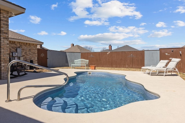 view of pool featuring a patio area, a fenced in pool, and a fenced backyard